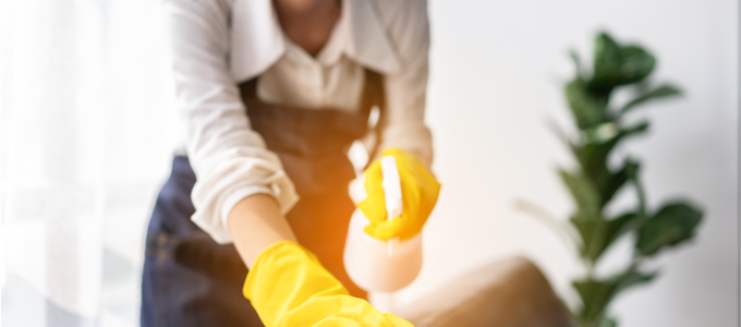 housewife-apron-wearing-gloves-spraying-hygiene-spray-t